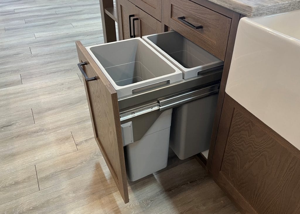 Potvin Construction says a waste and recycling management system is an essential accessory when designing kitchen cabinetry.