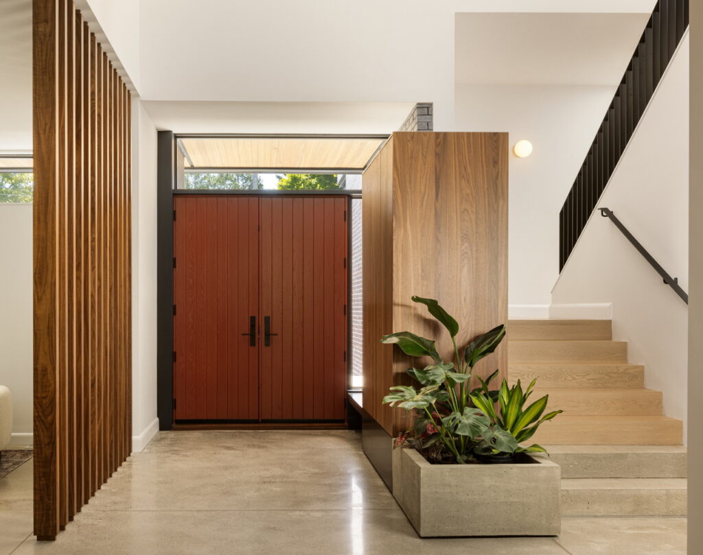 interior front entrance of a home showing stairs by Accurate Stairs and Railings