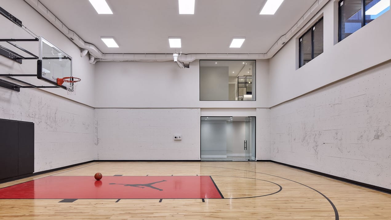 photo of a basement basketball court in a custom home