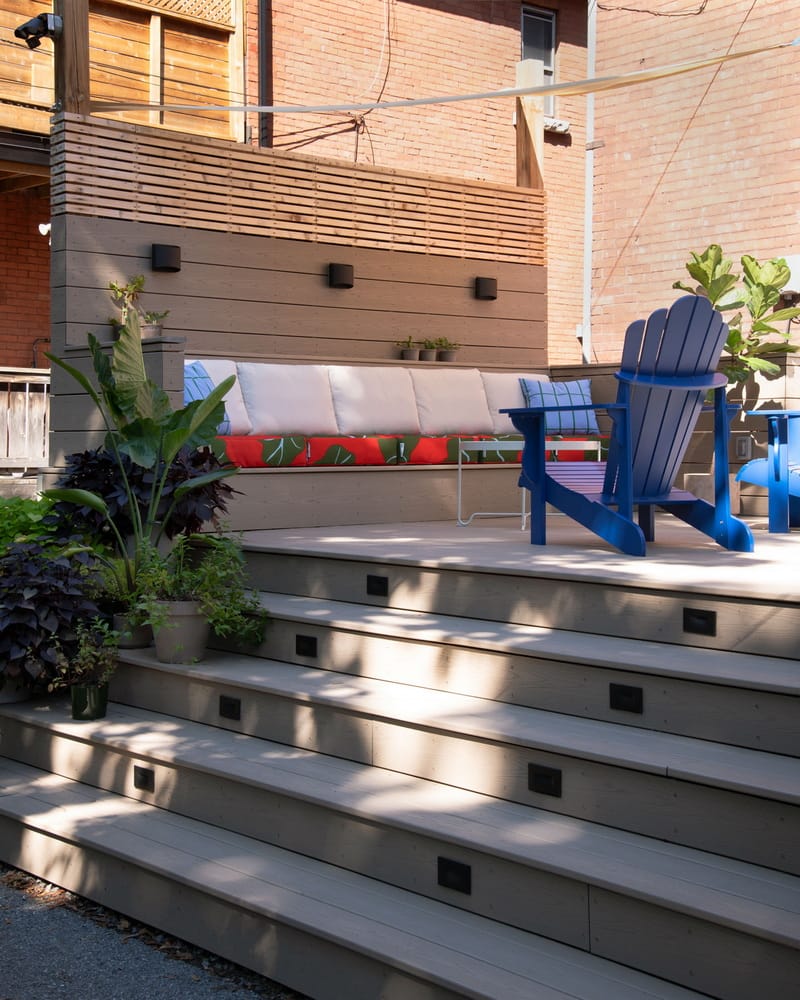 backyard deck showing inset accent lighting on the steps and wall dividers in a project by amsetd design-build