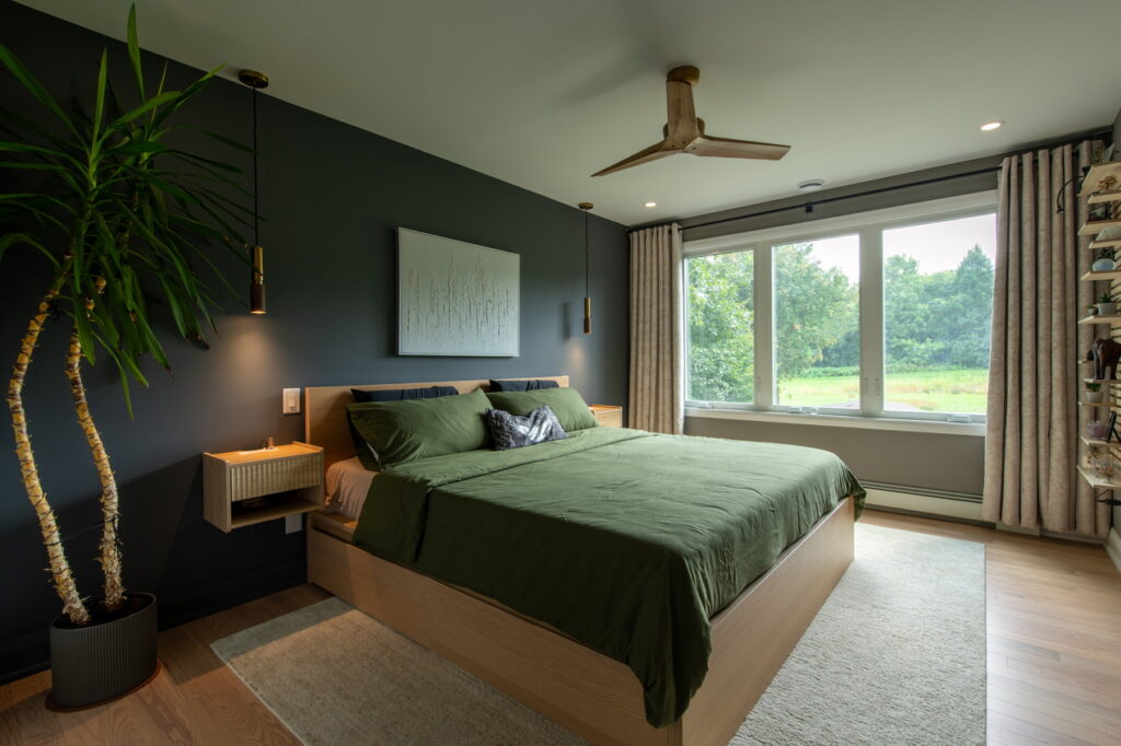 primary bedroom in a renovation and addition by Amsted Design-Build showing a mix of charcoal and light woods