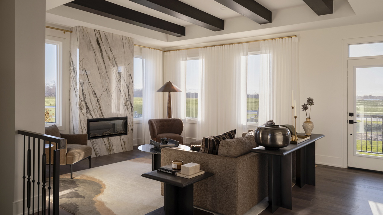 Photo of living room in Stonehaven by Caivan and Q4 Architects which won a model home award at 2026 OHBA Awards of Distinction