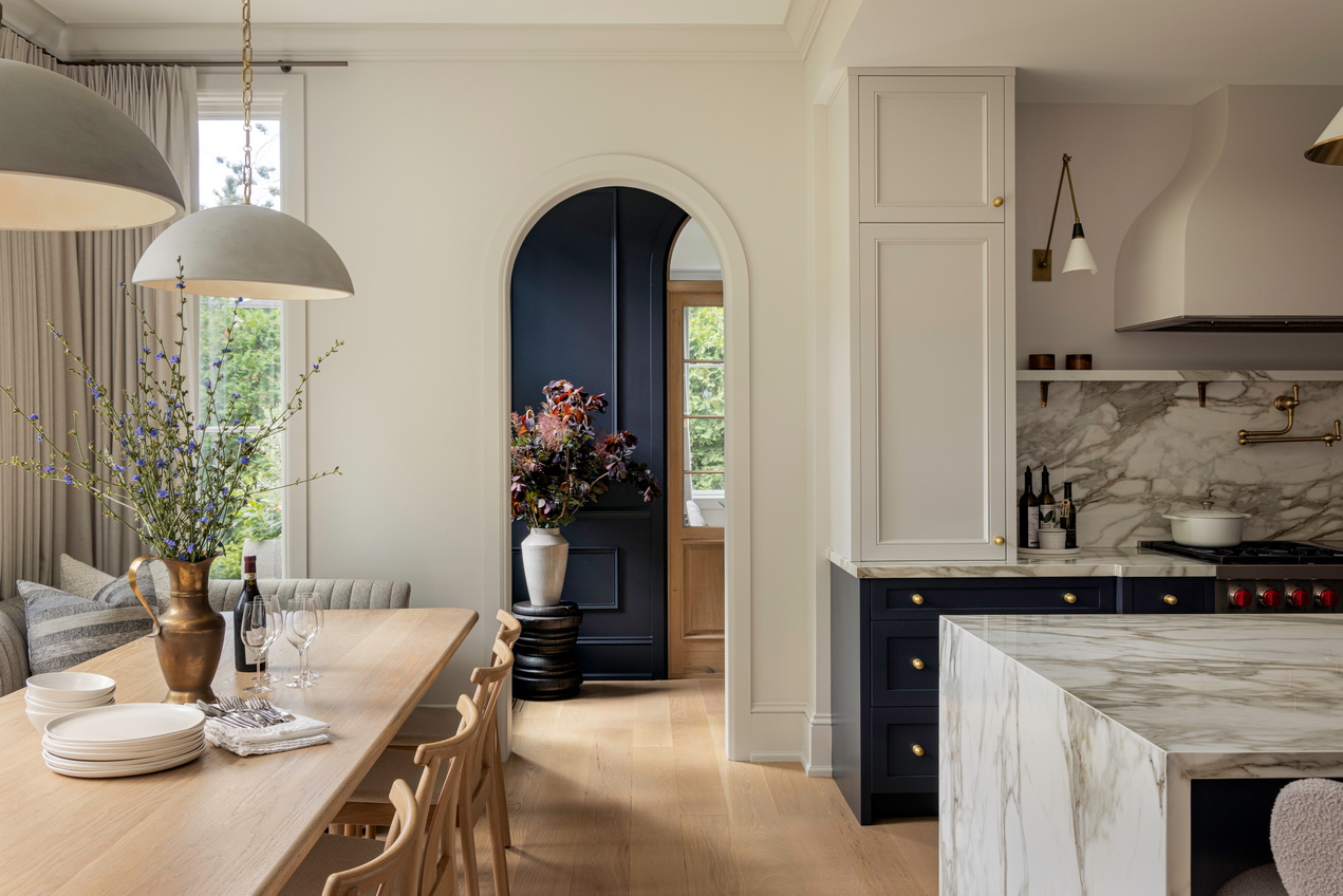 o’keefe Fiorenza ottawa renovation heritage home remodel award-winning kitchen waterfall island counter breakfast nook arched doorway curved hood vent traditional