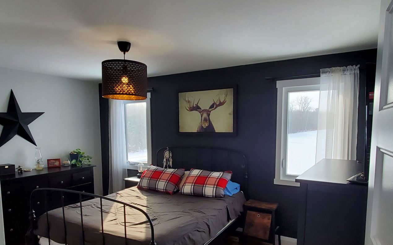 Photo of main bedroom in home built by College la Cite students.