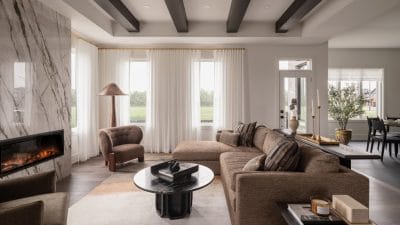 The Conservancy Caivan Ottawa homes living room ceiling beams fireplace