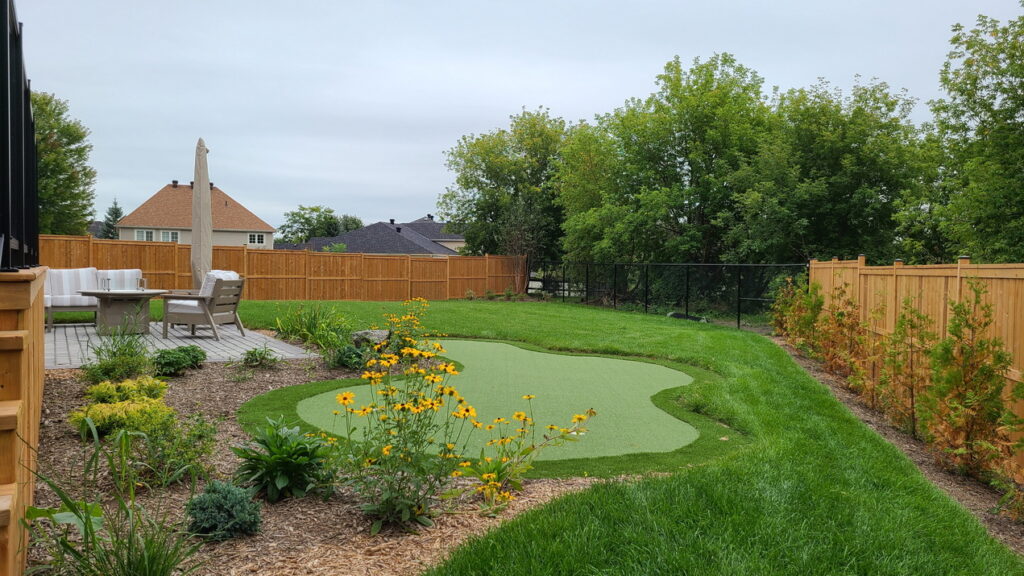 backyard of the 2026 Minto dream home showing the putting green