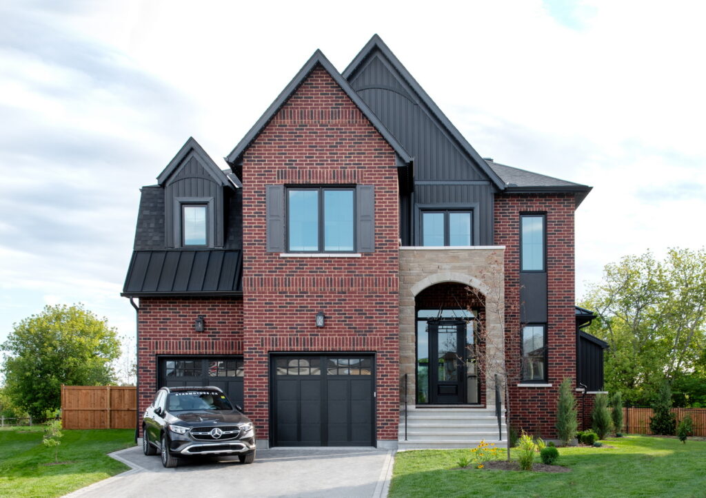 exterior of the 2026 Minto dream home in the CHEO Dream of a Lifetime lottery, shown with the Mercedes SUV that’s part of the grand prize package