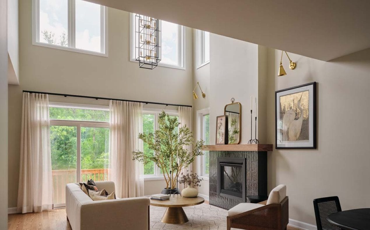 The living room with an 18-foot ceiling in the Madeline model home at Marshall's Bay by eQ Homes.