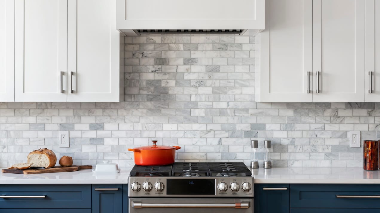 closeup photo of frameless kitchen cabinets around a stove