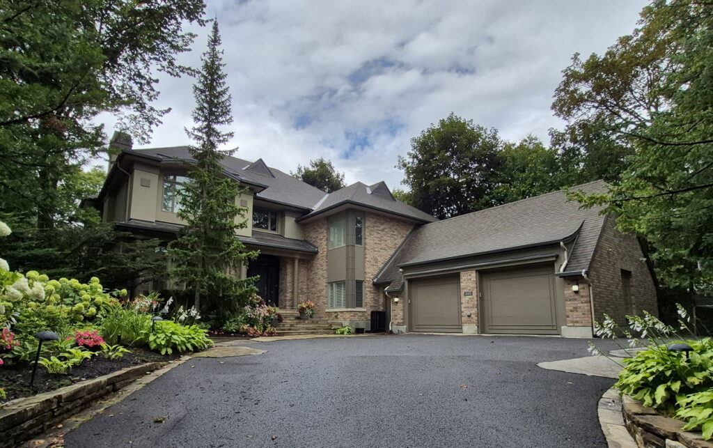 exterior and driveway of a two-storey Rockcliffe Park home