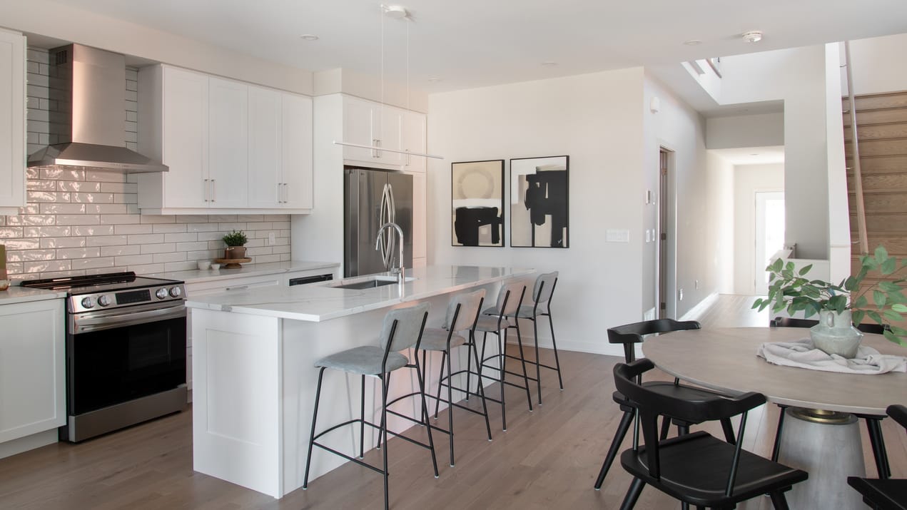 kitchen of the weston model by HN homes at Kanata Lakes done in light neutrals and mostly white