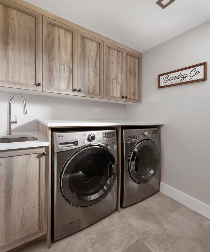 laundry room with wood shaker cabinets