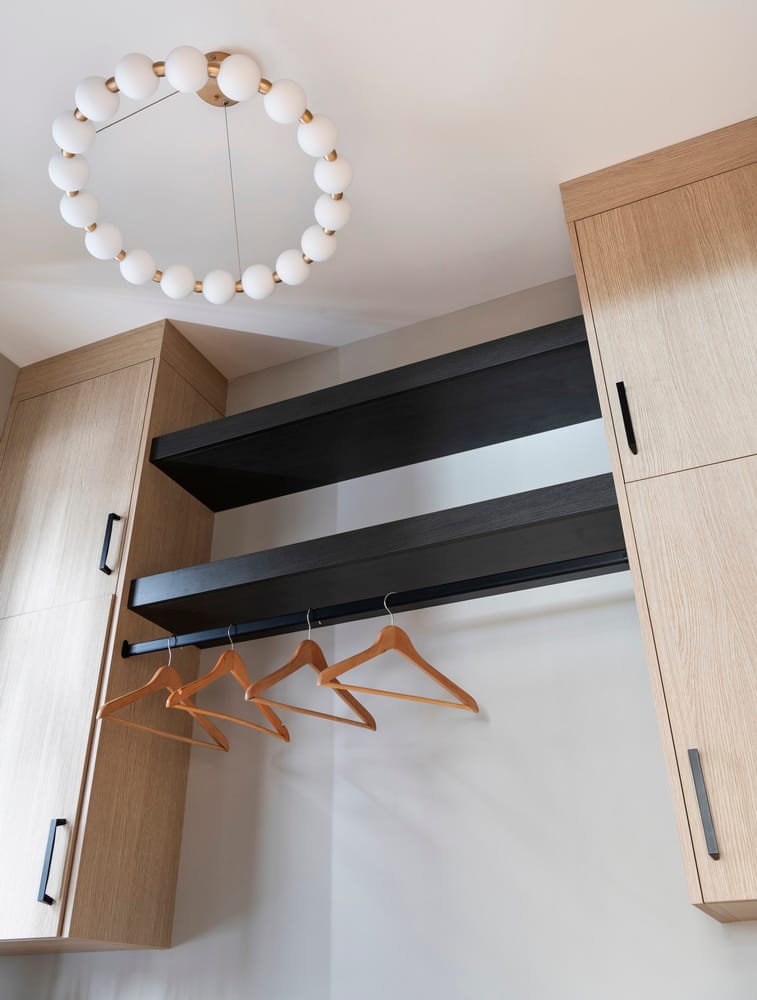 a funky laundry room ceiling fixture adds character and function, while undercabinet LED lighting helps with tasks