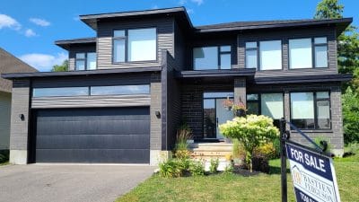 single-family home with a for sale sign in the Ottawa region July 2026 resale market