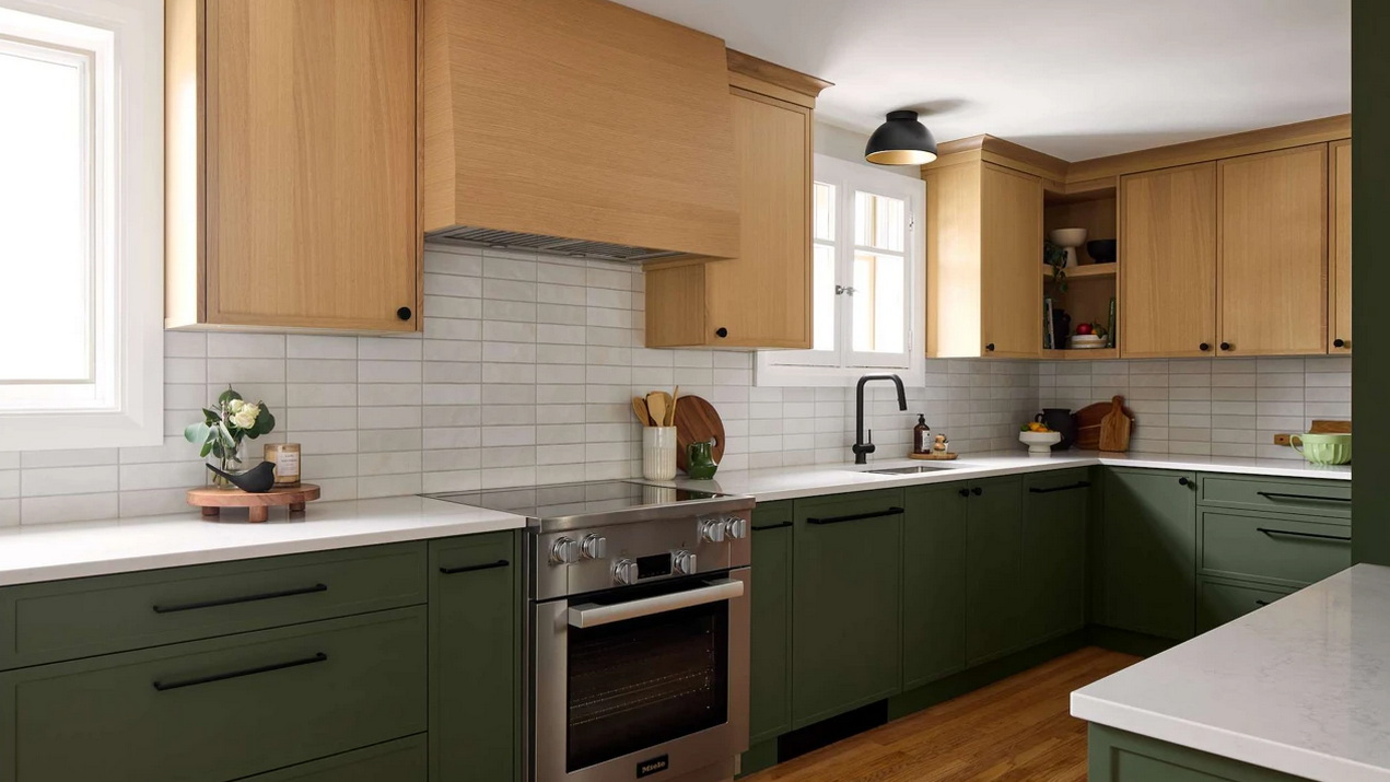 kitchen renovation in a century home with charcoal base cabinets paired with light-stained wood upper cabinets