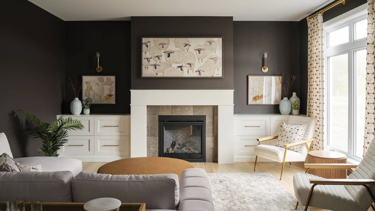 living room of the St. James model with fireplace and charcoal walls