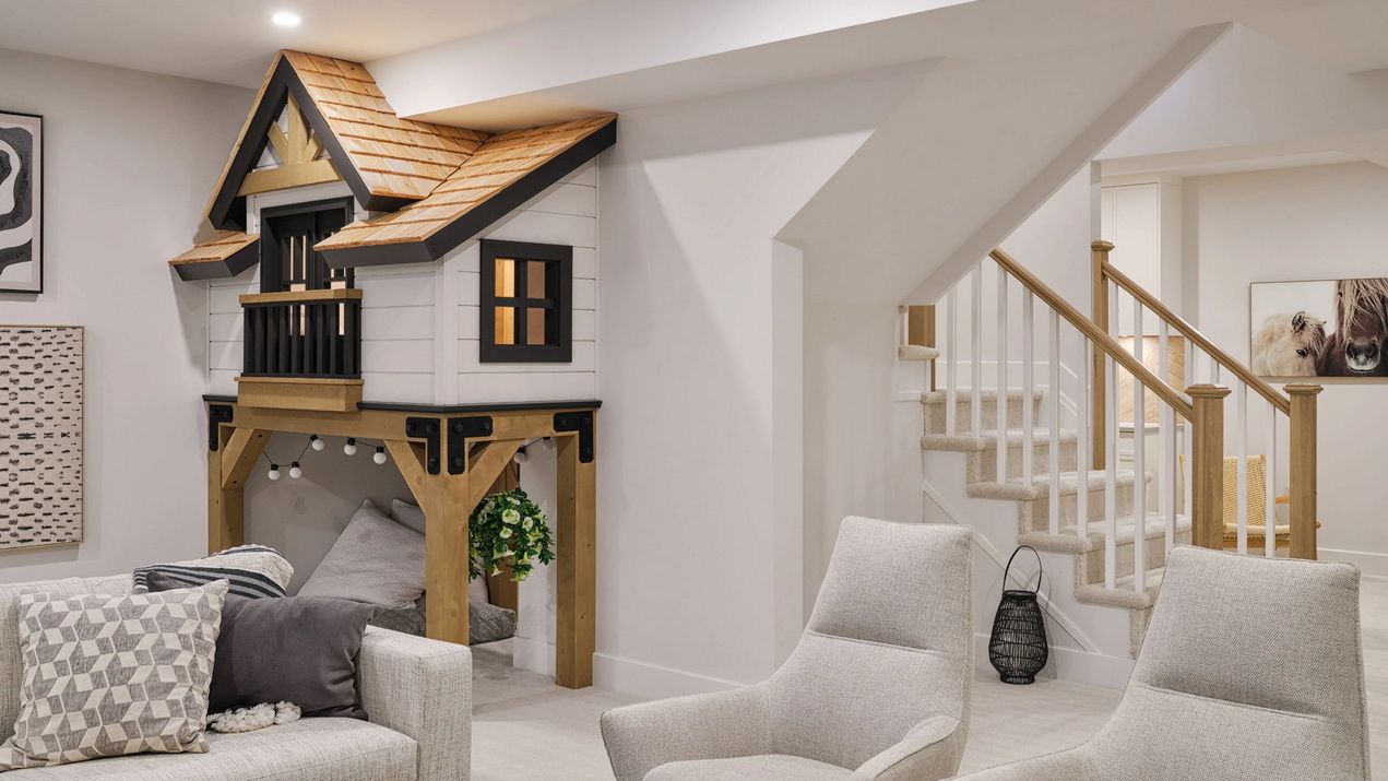 basement of the St. James model with fun kids’ house-within-the-house playroom under the stairs