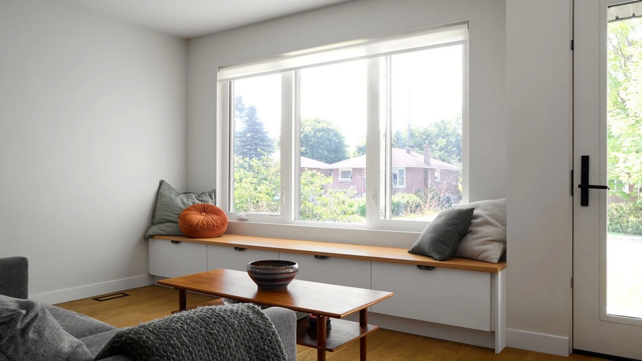 living room with window bench seat in a bungalow renovation by The Conscious Builder