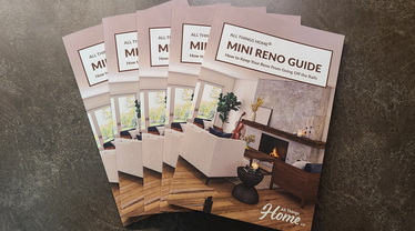 photo of fanned copies of the Mini Reno Guide, 2026 edition