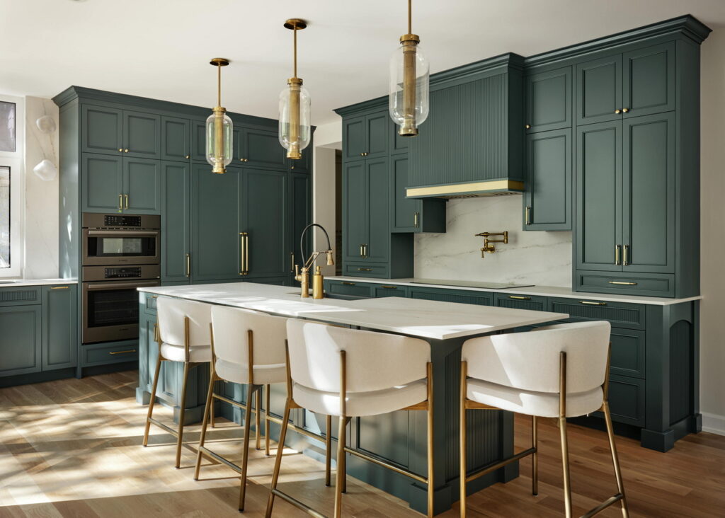 kitchen of a custom home by RND Construction with blue cabinets and an island with seating