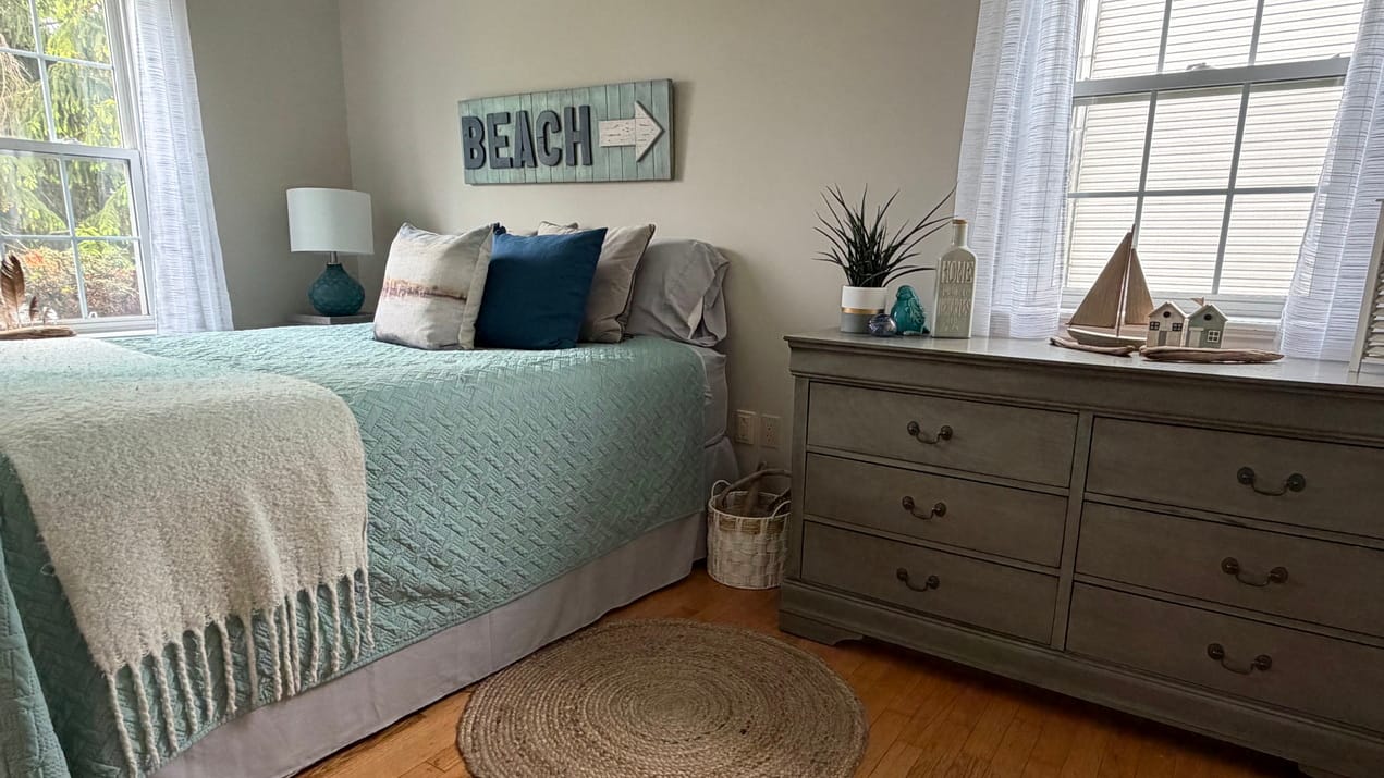 coastal or beach theme bedroom with soft blues, whites and natural textures