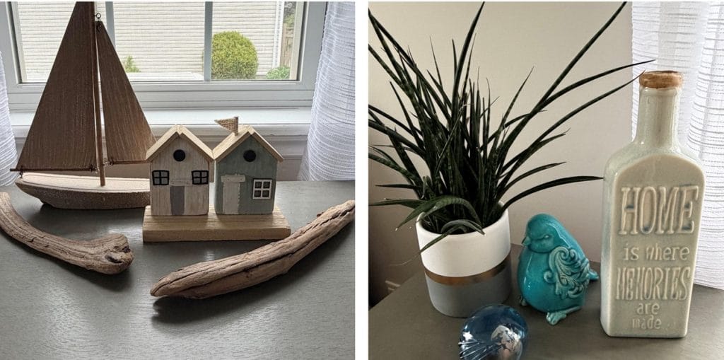 tabletop vignettes with a beach theme, including a wooden sailboat and house, driftwood, spiky plant ceramic bird and white glass bottle