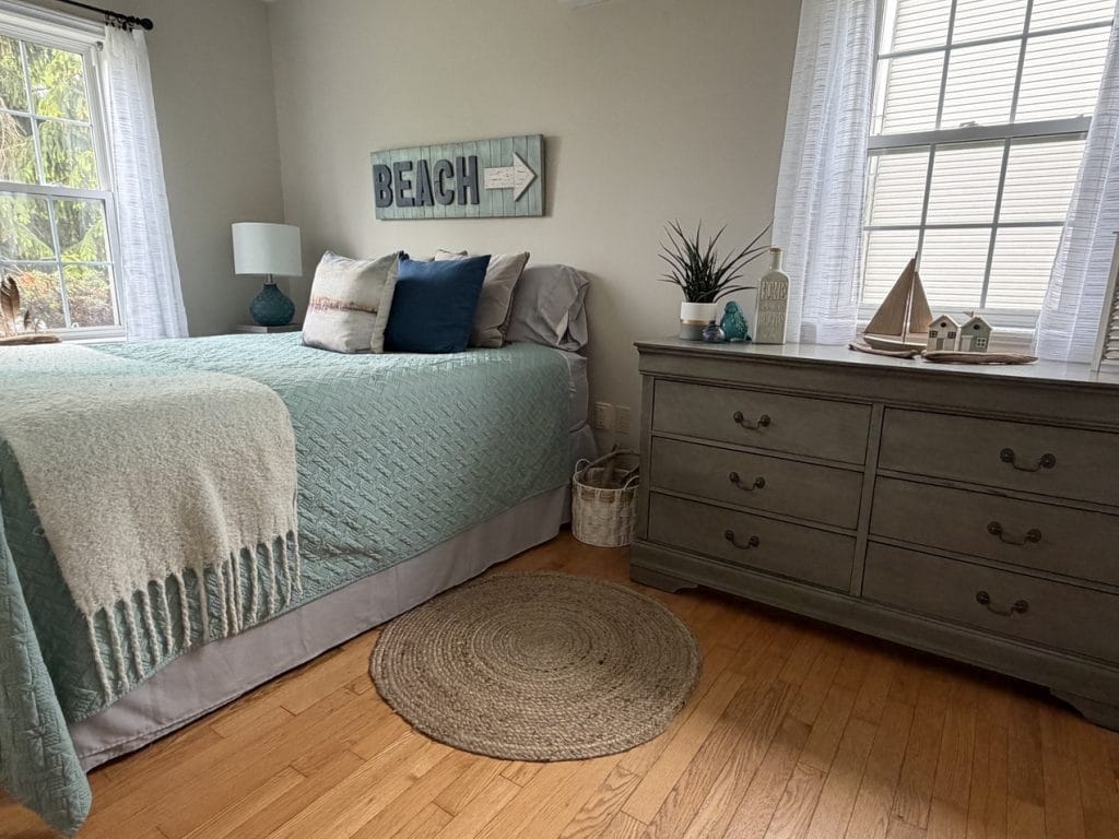 coastal or beach theme bedroom with soft blues, whites and natural textures