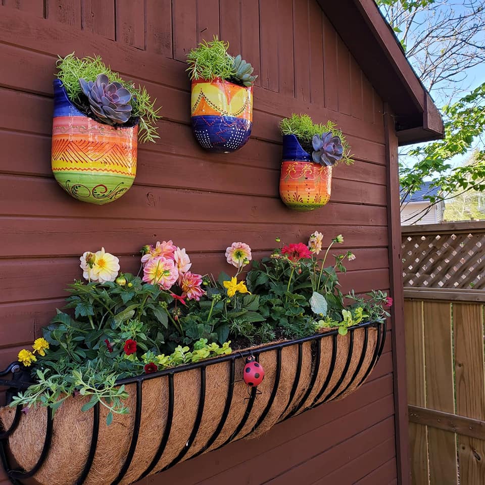 sue pitchforth yard decor backyard antique door plant pots on a wall