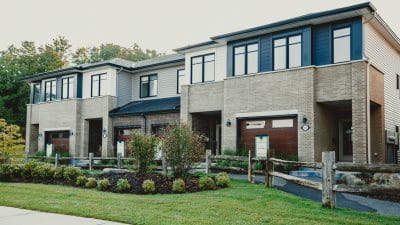photo of a row of contemporary townhome models at cardinal creek village in ottawa by tamarack homes