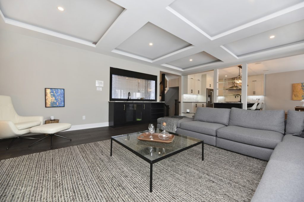 metric kanata multigenerational bubble wall coffered ceiling living room ottawa housing