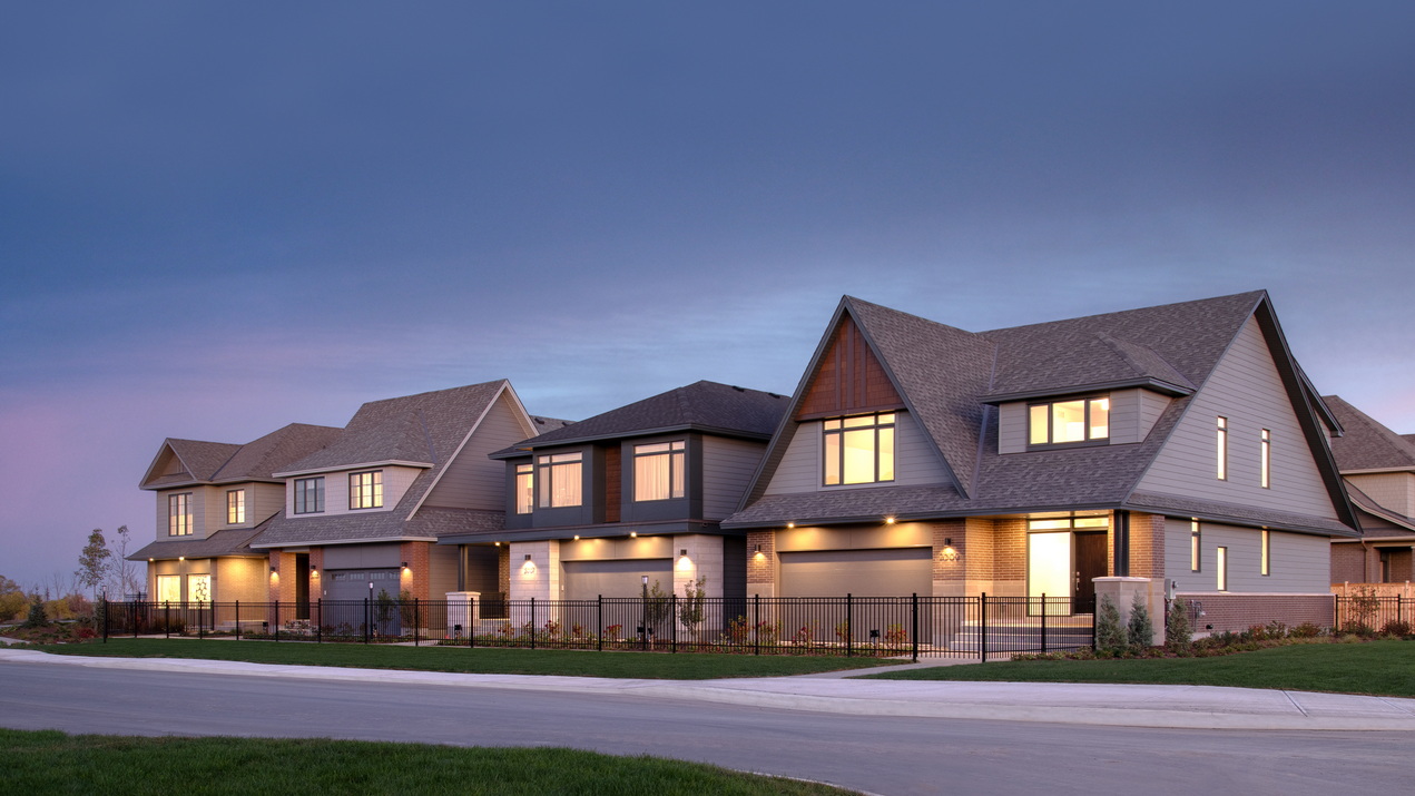 Twilight streetscape photo of Uniform’s single-family home models at Copperwood Estate