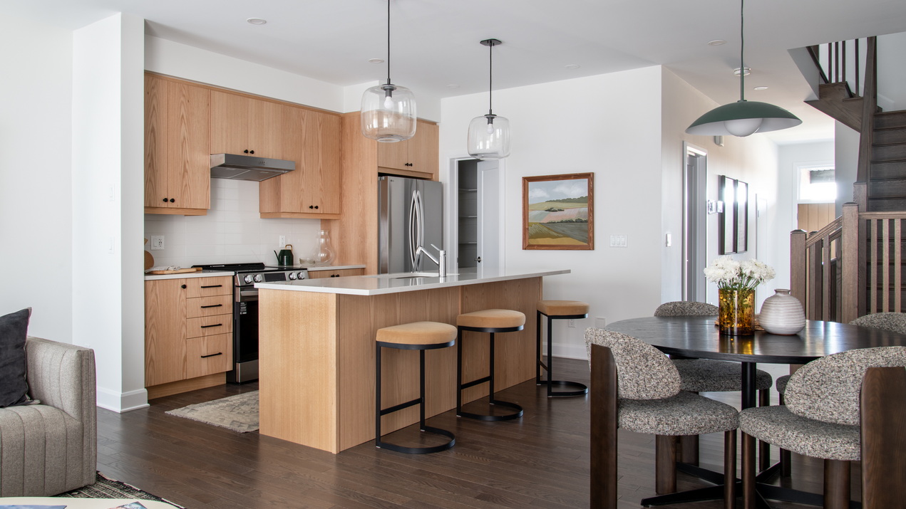 Open-concept kitchen and dining area of the Ferguson townhome by Uniform at Copperwood Estate
