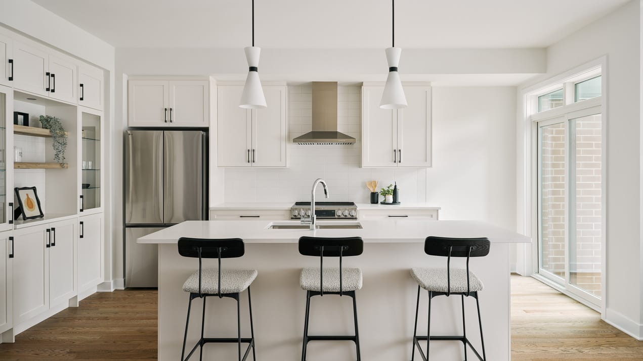 white kitchen in the Calypso townhome model by Urbandale at Riverside South