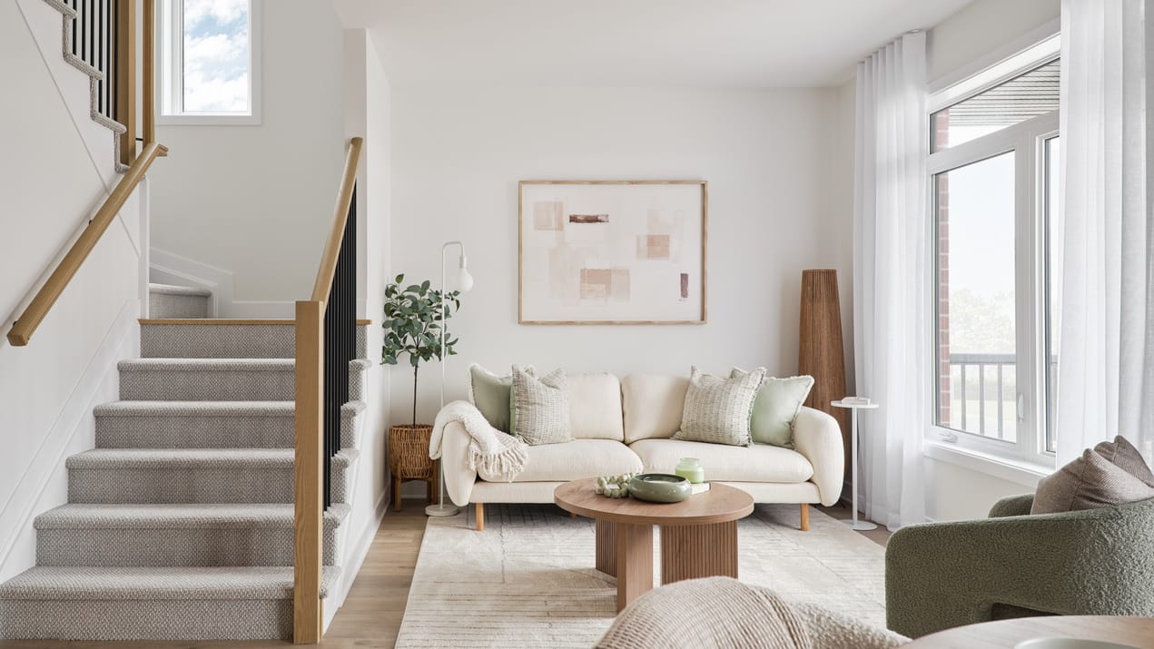 living room of the Dorchester three-storey townhome model by Urbandale at Riverside South
